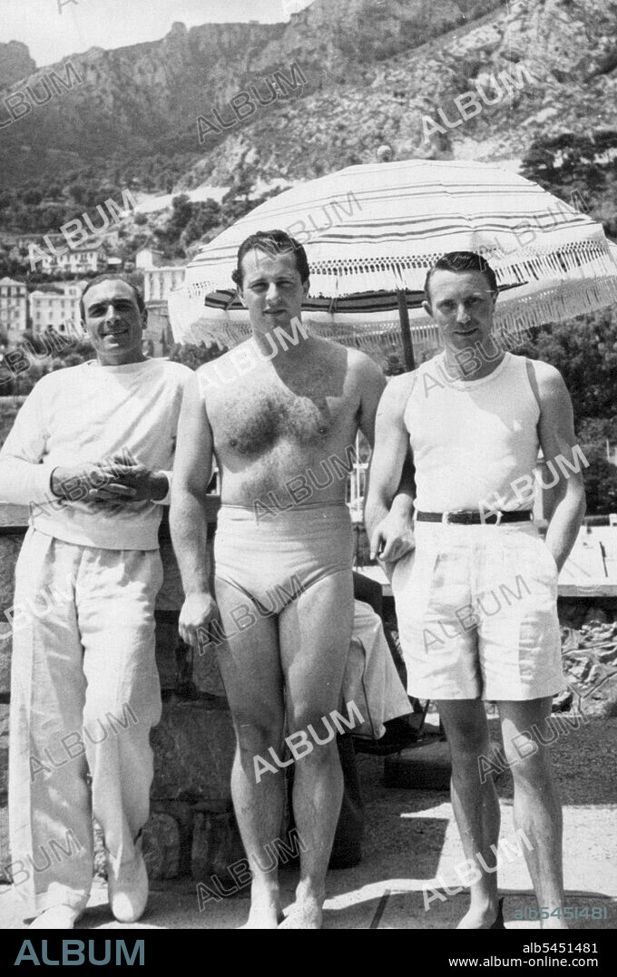 At Monte Carlo -- A trio of well known "Motecarlcites" Centre is Mr. Victor de Rotschild a keen water-skier, left is the Marquis de la Moussaye, and right, the Marquis de Casteja, both of whom have married daughters of the Hon. Mrs. Reginald Fellowes by her first husband Prince de Broglie. September 18, 1937. (Photo by London News Agency).