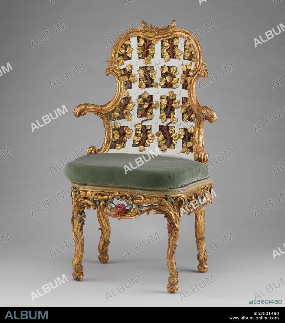Armchair (one of a pair) (part of a set). Culture: German, Würzburg. Dimensions: 44 x 26 x 21 in. (111.8 x 66 x 53.3cm). Maker: Attributed to Johann Michael Bauer (German, Westheim 1710-1779 Bamberg). Date: ca. 1763-64.
The settees and chairs illustrated here (see 1974.356.114-.121) were made for the Franckenstein Pavilion in the gardens of Seehof Castle near Bamberg, one of the three summer residences in Southern Germany used by Adam Friedrich von Seinsheim, prince bishop of Würzberg and Bamberg. A true garden enthusiast, it was under von Seinsheim that the gardens of Seehof were embellished, which must have resembled the still extant Rococo gardens completed by von Seinsheim at Veitshöchheim. His love for gardens and garden imagery also carried over into the interior decoration and furnishings of his castles, as the Seehof furniture demonstrates. A unique example of German Rococo furniture executed in a more flamboyant style than its French prototypes, the ensemble was designed specifically for the Garden Room in the Franckenstein Pavilion. Used as an audience room, it was referred to as the "Green Trellis Chamber" in the 1774 Seehof inventory and painted entirely with trompe l'oeil trellis and foliage. The garden room's furniture was made to match: the backs of the chairs and settees are richly carved in the form of garden trellis-work with colored flowers and foliage.