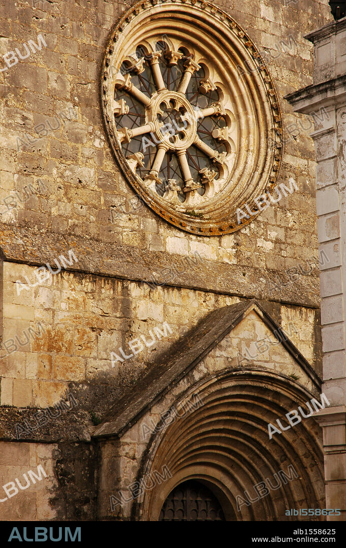 Portugal, Santarém. Sao Joao de Alporao Church. 12th-13th centuries. Romanesque and Gothic styles. Architectural detail of the facade, with the rose window which lights up the single interior nave, the location of the Archaeological Museum. Santarem District.