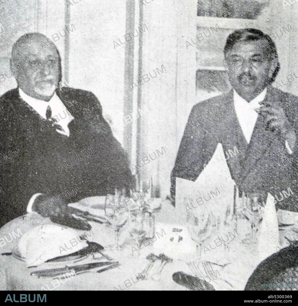 Black and white photo of Pierre Laval (1883-1945), twice Prime Minister of France, and Fernand Bouisson (1874-1959), French politician, having breakfast at the Triannon Palace.