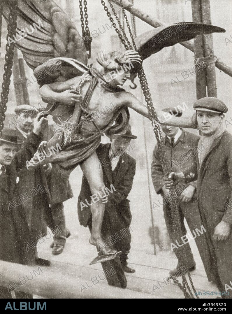 The removal of the statue of Eros from Piccadilly Circus, London, England in 1925 during the reconstruction of the underground railway station. From The Story of 25 Eventful Years in Pictures, published 1935.