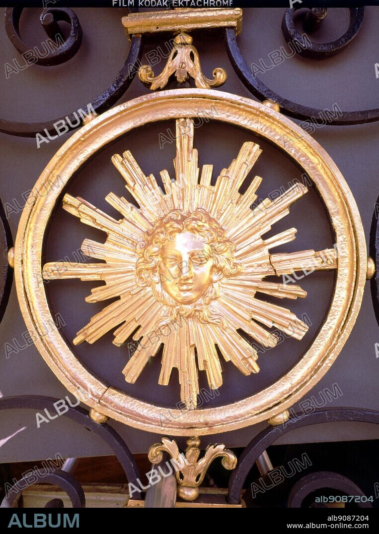 The Sun King, Coat of Arms, from a balcony in the Place Vendome, Paris. Ornately decorated with an emblem of Louis XIV. The Sun King by Nancy Mitford, back cover.