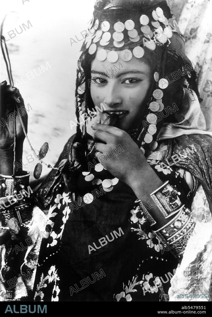 Berbers are the indigenous peoples of North Africa west of the Nile Valley. They are discontinuously distributed from the Atlantic to the Siwa Oasis, in Egypt, and from the Mediterranean to the Niger River. Historically they spoke various Berber languages, which together form a branch of the Afro-Asiatic language family. Photograph by Lehnert & Landrock: Rudolf Franz Lehnert (Czech) and Ernst Heinrich Landrock (German) had a photographic company based in Tunis, Cairo and Leipzig before World War II. They specialised in somewhat risque Orinetalist images of young Arab and Bedouin women, often dancers.