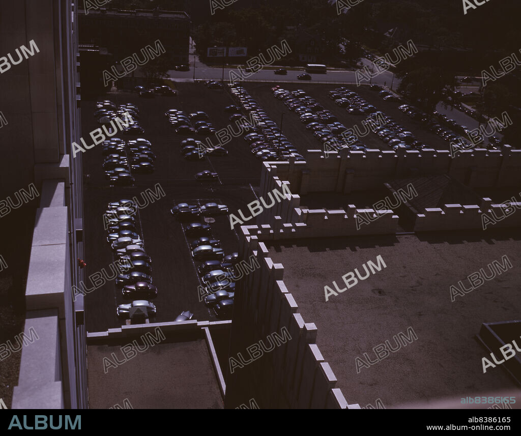 ARTHUR S SIEGEL. Looking down on a parking lot from the rear of the Fisher Building, Detroit, Mich.