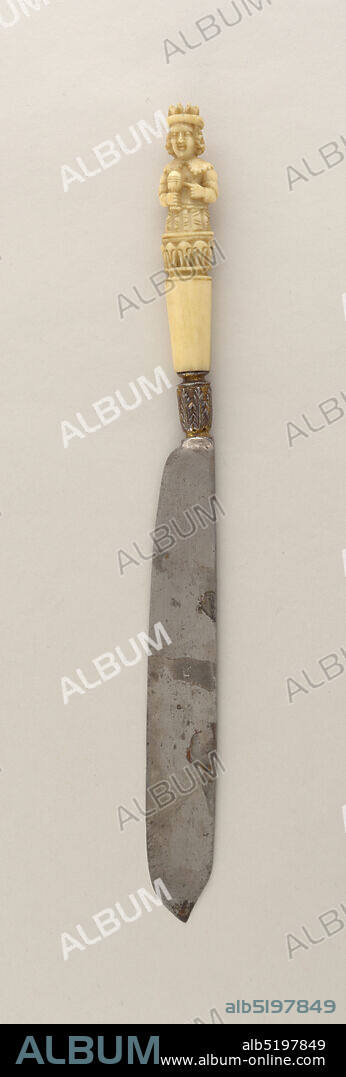 Knife, ivory (whale bone?), silver, steel, gold, Sabre-shaped blade with straight upper edge; plain bolster. Silver ferrule engraved with leaf-pattern; has traces of gilding. Carved ivory handle, oval in section, has plain lower part and a decorative pattern around the middle of the handle. Upper part of handle carved in the shape of a king (shown from the waist up) wearing a crown. He is holding a chalice in one hand while pointing to it with the other hand., possibly France, ca. 1600, cutlery, Decorative Arts, Knife.