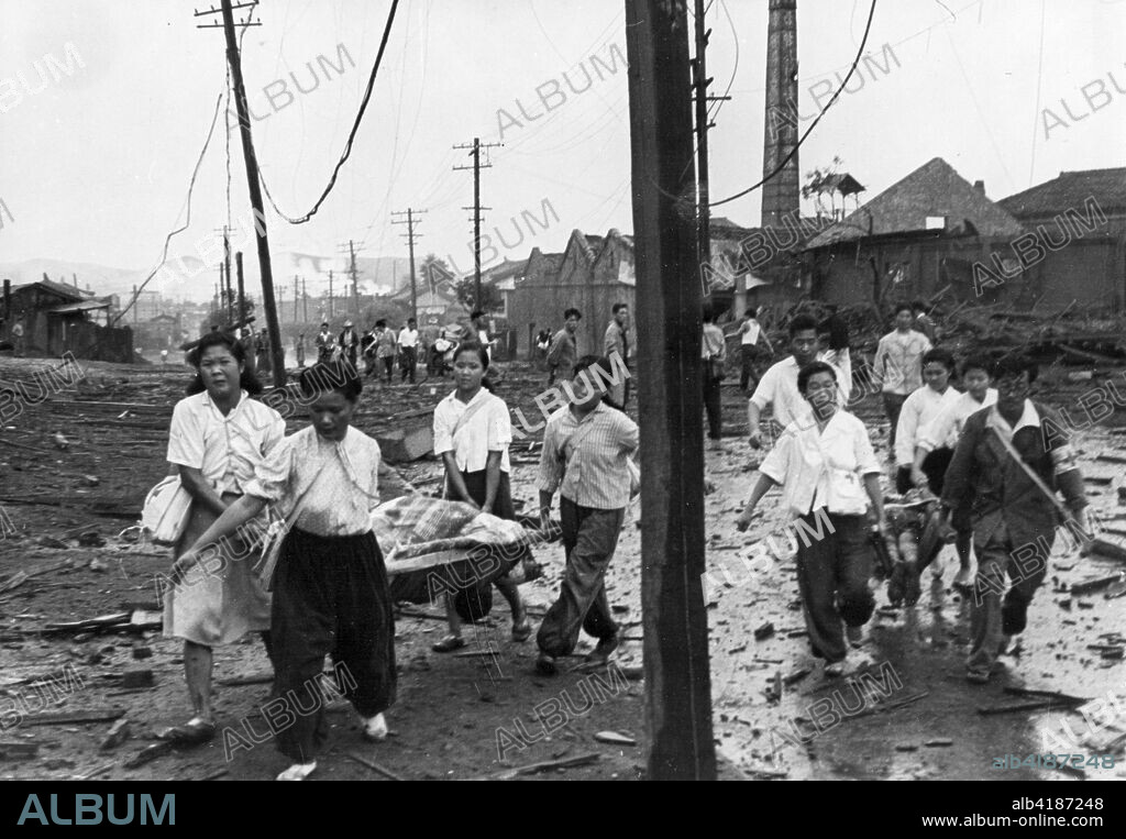 Pyongyang, North Korea. Korean War. Stretcher-bearers, after digging out the wounded from under ruins, carry them to the nearest first-aid station. October 1950.