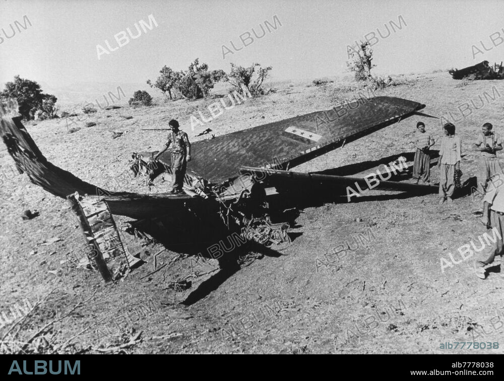 Iran-Iraq war (22.09.1980 - 20.08.1988) / Battle of Khorramshahr / destruction of the war. The city of Khorramshahr in Iran, located about 40 kilometers southeast of Basra in Iraq, has been at the center of events since the beginning of the war. The Battle of Khorramshahr, which lasted seven weeks from September 22 to November 10, 1980, left a ghost town that was renamed "Khuninshahr" meaning "City of Blood." A group of young men is looking at a shot-down Iraqi plane. Photo, 02.10.1980.