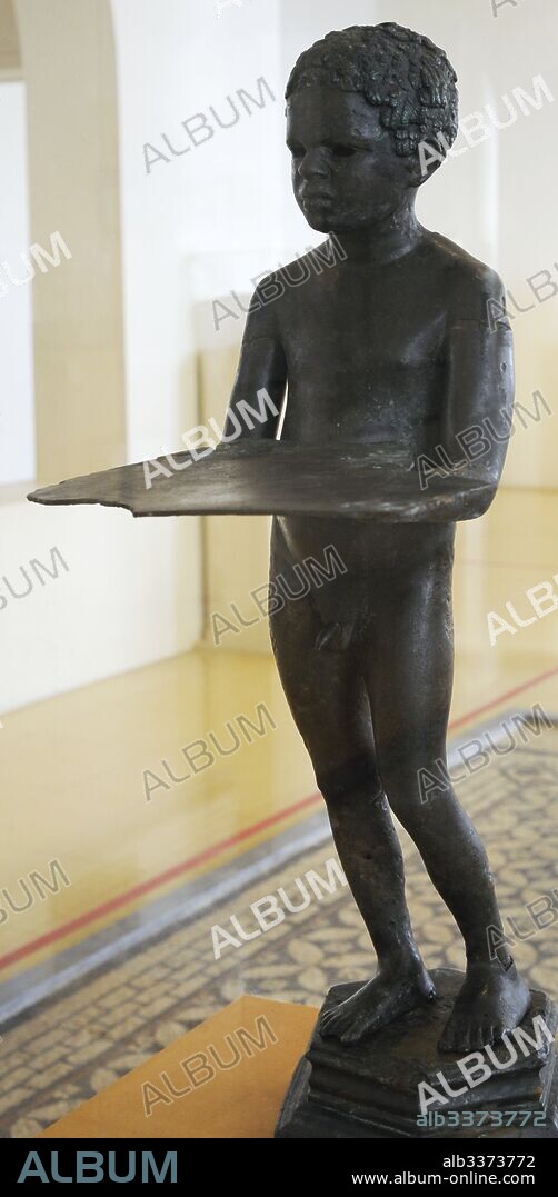 Anthropomorphic lamp. High-Imperial Period. Bronze. Popularly called "The Negret." It represents an Ethiopian boy slave holding a tray. Quarry of port, Tarragona, Spain. National Archaeological Museum. Tarragona. Catalonia, Spain.