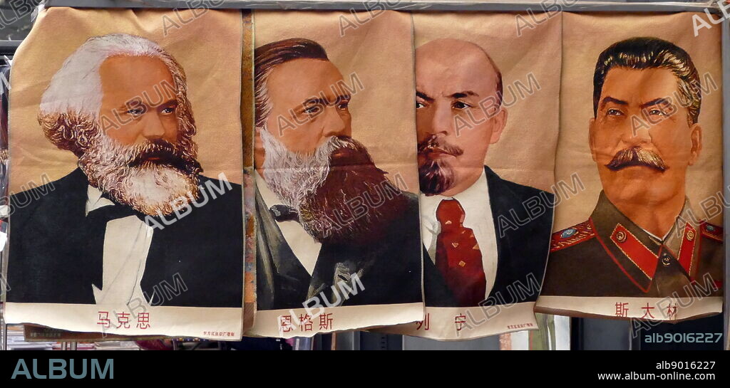 Portraits of Karl Marx, Friederich Engels, Vladimir Lenin and Joseph Stalin in a Chinese market.