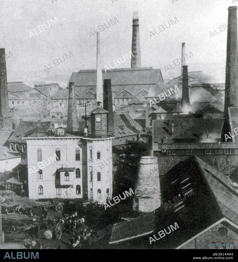 The Krupp family, a prominent 400 year old German dynasty from Essen, have become famous for their production of steel, artillery, ammunition, and other armaments. Friedrich Krupp built a pioneering steel foundry in Essen in 1810. His son Alfred invested heavily in new technology to become a significant manufacturer of steel rollers and railway tires. He also invested in the revolutionary Bessemer process and acquired many mines in Germany and France. The company began to make steel cannons in the 1840s. Low non-military demand and government subsidies meant that the company specialized more and more in weapons: by the late 1880s the manufacture of armaments represented around 50% of Krupp's total output. At the time Krupp's was the world's largest industrial company and the largest private company in the German empire. When Adolf Hitler came to power in Germany in 1933, the Krupp works became the center for German rearmament. The choices of the Krupp family and firm during the Nazi era, including support of Hitler and use of forced labour, are part of the legacy. No photographer credited, 1861.