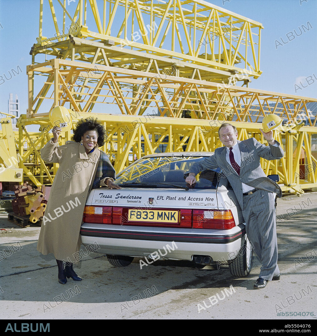 JOHN LAING PLC. Borehamwood, Elstree and Borehamwood, Hertsmere, Hertfordshire, 23/02/1989. EPL Managing Director Derek Welsh and Olympic athlete Tessa Sanderson posing with her sponsored Rover car, presumably at the EPL depot in Borehamwood. Tessa Sanderson had a sponsorship deal with EPL, part of the Laing Group.