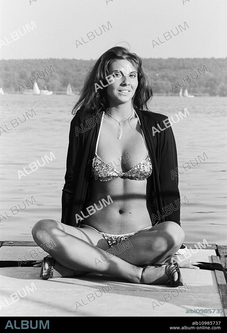 Swiss actress, beauty queen, model and racing driver Jolanda Egger posing in a bikini for a photo shoot, Germany around 1983.