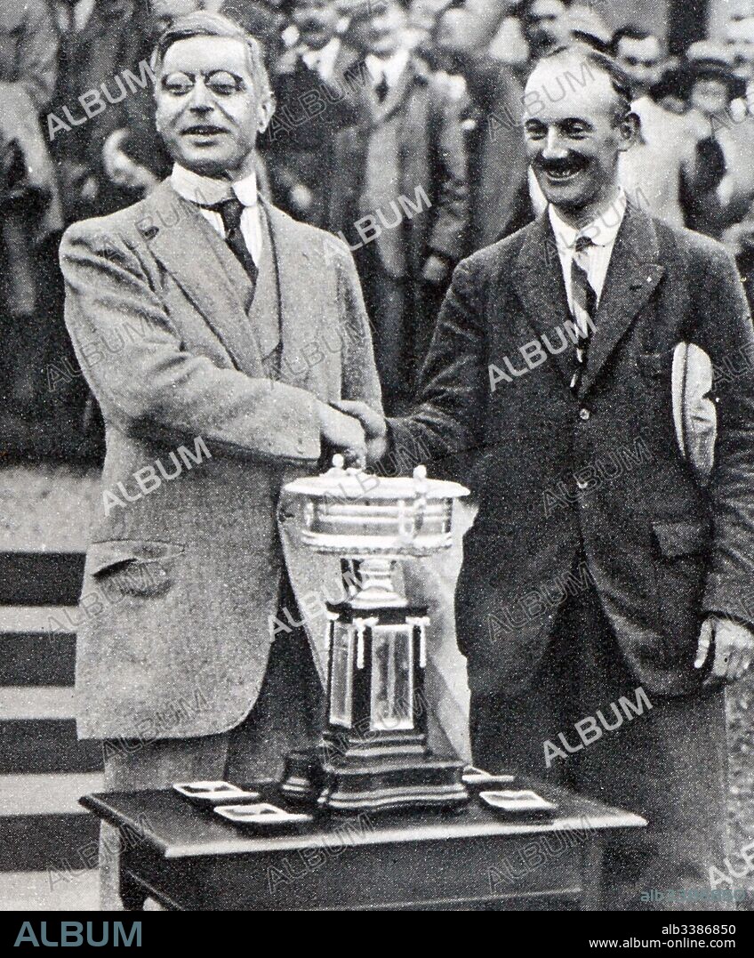 Photograph of Alexander Walker II (1869-1950) presenting an award to the new Scottish Amateur Golf Champion T. M. Burrell. Dated 20th Century.