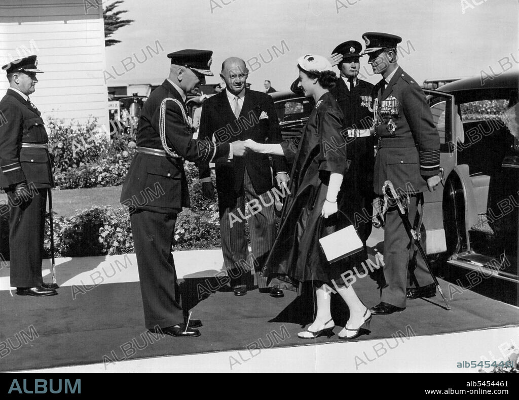Royal Tour Victoria. The Queen and the Duke of Edinburgh as Marshal of the Royal Air Force welcomed at the R.A.A.F. Station Point Cook. From left Air Marshal Macaulay and the Minister for Air Mr. McMohon. March 12, 1954.