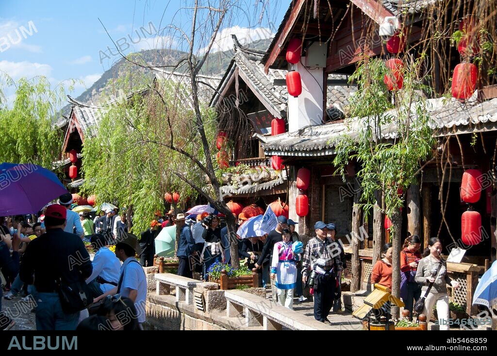 The Naxi or Nakhi are an ethnic group inhabiting the foothills of the Himalayas in the northwestern part of Yunnan Province, as well as the southwestern part of Sichuan Province in China. The Naxi are thought to have come originally from Tibet and, until recently, maintained overland trading links with Lhasa and India. The Naxi form one of the 56 ethnic groups officially recognized by the People's Republic of China. The Naxi are traditionally followers of the Dongba religion. Through both Han Chinese and Tibetan cultural influences, they adopted Tibetan Buddhism and, to a lesser extent, Taoism, in the 10th century. The Old Town of Lijiang dates back more than 800 years and was once an important town on the old Tea Horse Road.
