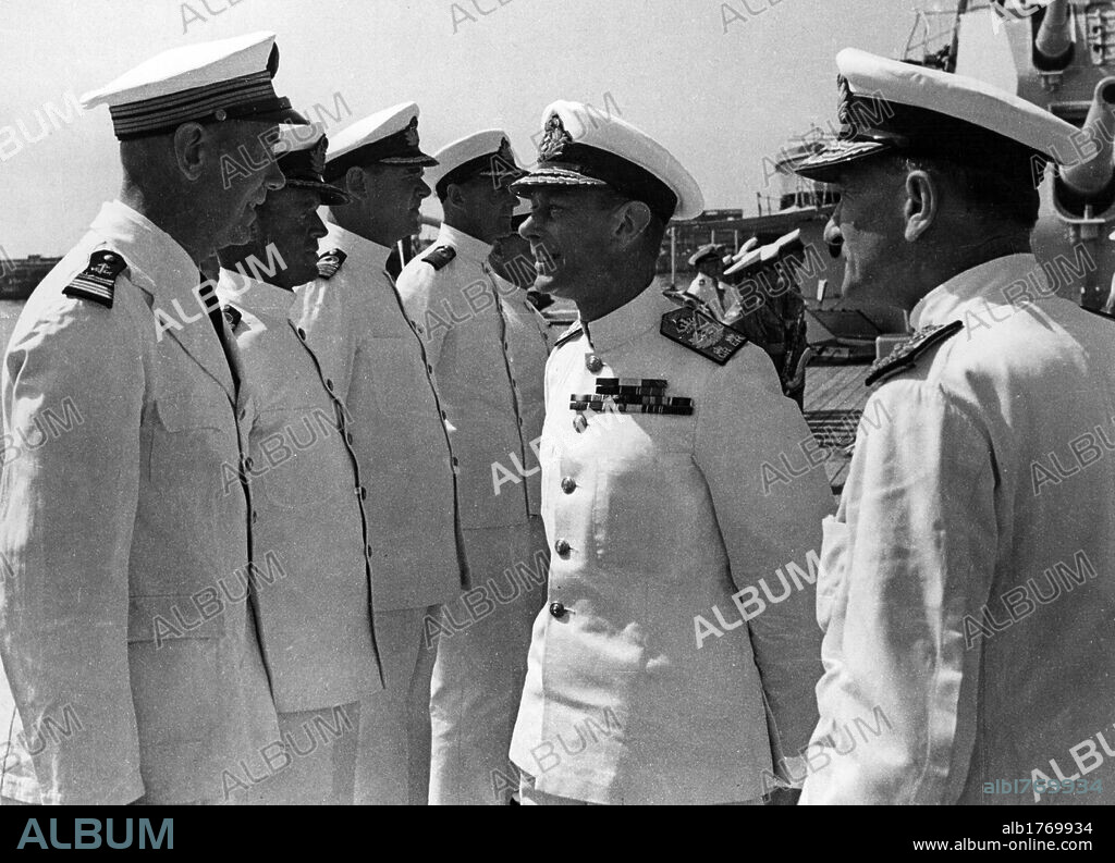 King George VI with Andrew Cunningham and other officers. King George VI of the United Kingdom and Admiral Sir Andrew Cunningham inspecting the fleet units and staying on talking with some officers. Naples, July 1944.
