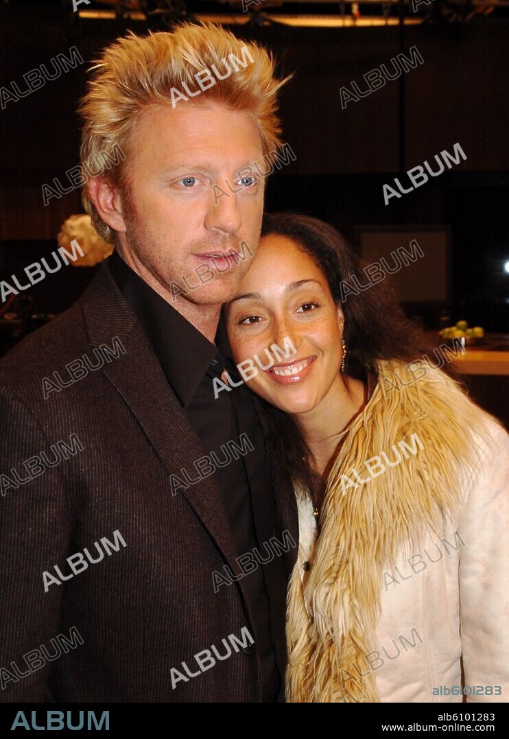 (dpa) - German tennis legend Boris Becker and his girlfriend, dancer Caroline Rocher, pose in the studios of sports television channel DSF in Munich, Germany, 12 October 2004. Boris Becker is hosting the sports talk show 'Becker 1:1'. 12/10/2004