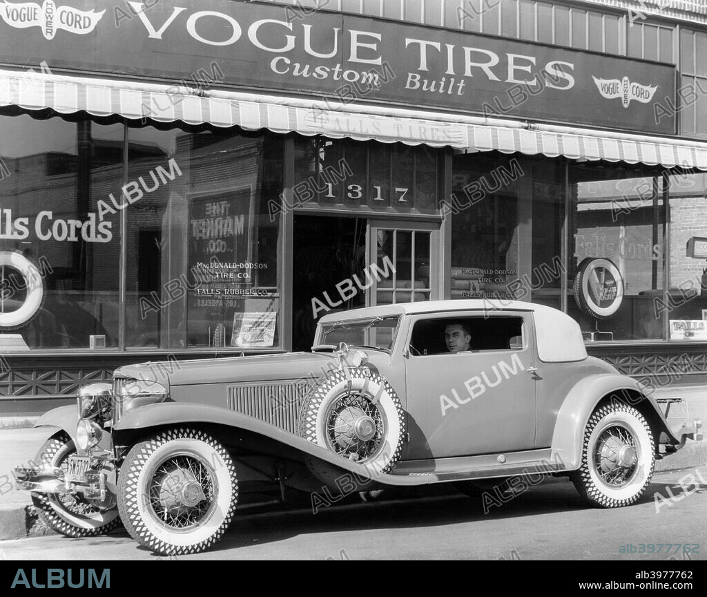Cord L29 parked outside a showroom, USA, c1929-c1930. The Cord L29 was the first production front wheel drive car made in America. Although EL Cord, owner of the Auburn Automobile Company, predicted that front drive would be adopted by the automobile industry within a few years of the L29's introduction, general production of front wheel drive did not occur for another half a century.