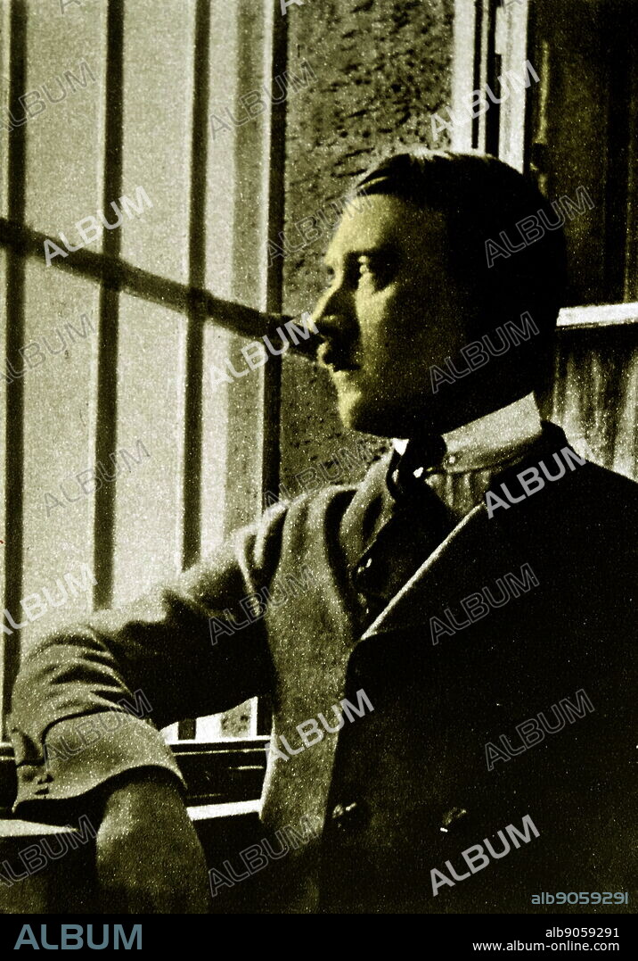 Adolf Hitler (1889-1945) looking out of the bars on the window to his prison cell at Landsberg Prison. In 1924 Adolf Hitler spent 264 days incarcerated in Landsberg after being convicted of treason following the Beer Hall Putsch in Munich the previous year. During his imprisonment, Hitler dictated and then wrote his book Mein Kampf with assistance from his deputy, Rudolf Hess.