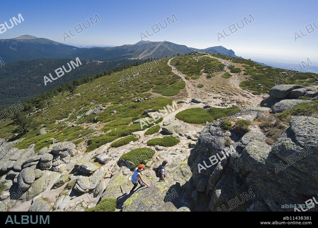 Hikers at Sietos Picos (Seven Peaks), in Guadarrama, Madrid, Spain, Europe.