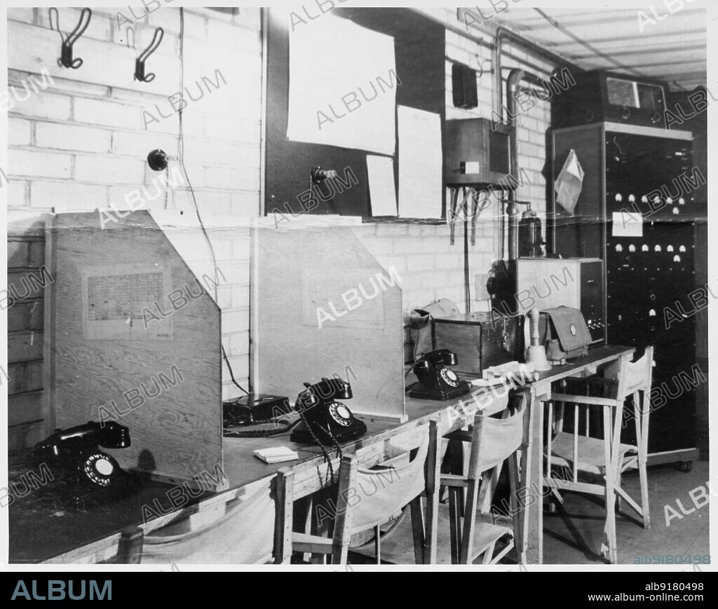 Royal Naval Cordite Factory, Wareham Road, Holton Heath, Wareham St. Martin, Dorset, 1939-1945. A photograph taken during the Second World War showing the interior of the control trench, Royal Naval Cordite Factory. The control trench was an underground room providing emergency communications and bomb plotting equipment during WWII.