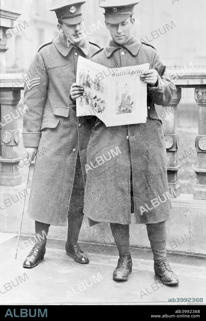 Soldiers reading the Suffragette newspaper, April 1915. That week's editorial by Christabel Pankhurst expressed intensely anti-German sentiments typical of the time. The front cover image is a reproduction of a French cartoon of Joan of Arc (St Joan) in full military armour, hovering as an angel above Rheims Cathedral, which had been badly damaged in September 1914. The headline screams: 'That which the fire and Sword of the Germans Can Never Destroy'.