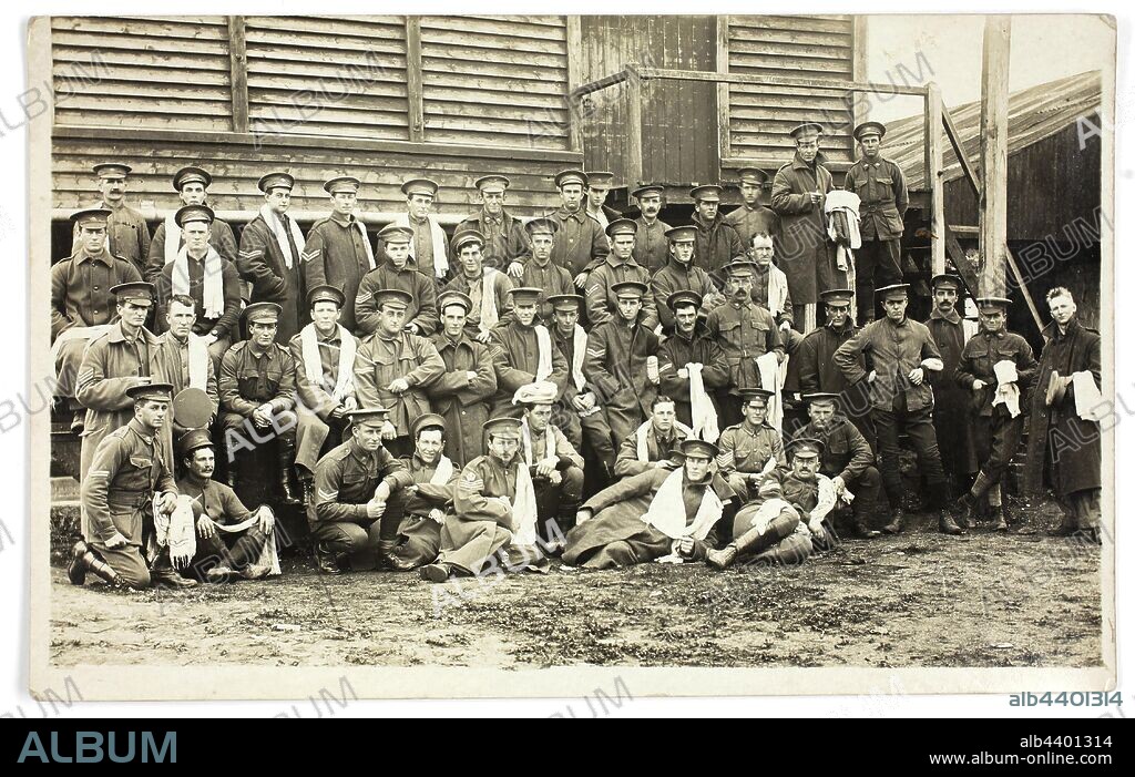 Photograph - Australian Servicemen Group, NCO School, Geelong, Victoria, Australia, 16 Jul 1916, Photograph taken at the NCO (Non Commissioned Officers) School, Geelong, 16.7.1916, during World War I. The photograph shows troops on bath parade. The writer indicates that it depicts 'Isolated B Block. Measles', adding 'note my hair dear.' The provenance of the postcard is otherwise unknown.
