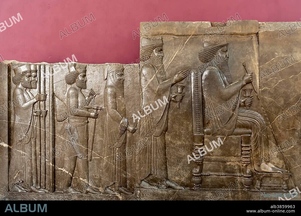 Ancient treasure house relief of the Achaemenids, audience relief of Darius I, seated on the throne, behind crown prince Xerxes I, archaeological relic from the ancient Persian city of Persepolis, National Museum of Iran, Tehran, Iran, Asia.