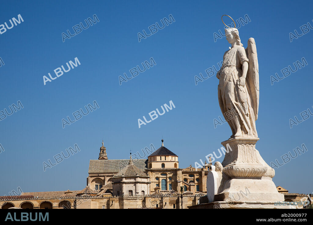 BERNABE GOMEZ DEL RIO. Spain, Andalusia, Cordoba, Roman Bridge, Statue of Archangel Raphael . The local popular devotion to Saint Raphael dates back to the 16th century when, according to legend, Raphael appeared to Father Reolas and promised that he'll watch over the city.