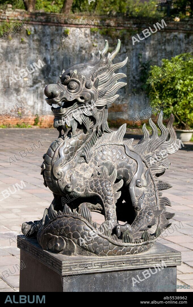 Emperor Gia Long ordered the construction of Hue Citadel in 1805. The vast complex is built according to the notions of fengshui or Chinese geomancy, but following the military principles of the noted 18th century French military architect Sebastien de Vauban. The result is an unusual and elegant hybrid, a Chinese-style Imperial City carefully aligned with surrounding hills, islands and waterways, but defended by massive brick walls between 6-12 metres high and 2.5 metres thick, punctuated by towers, ramparts, a massive earth glacis, and 24 Vauban-inspired bastions. The entire complex was further protected by wide moats, crossed by gracefully arched stone bridges leading to ten gates, the chief of which is Cua Ngo Mon, the south-east facing ‘Meridian Gate’. To compound the exotic hybrid effect, guard posts designed as Chinese-style miradors, complete with sweeping eaves crowned by imperial dragons, surmounted each gate. Finally, directly in front of the Ngo Mon Gate, a massive brick fort 18 metres high was constructed both as an additional barrier against malign spirits, and as a defensive redoubt. The area within the Citadel - in all, 520 hectares (1300 acres) - comprises three concentric enclosures, the Civic, Imperial and Forbidden Purple Cities. Access is by way of ten fortified gates, each of which is reached by a low, arched stone bridge across the moat. In imperial times a cannon would sound at 5am and 9pm to mark the opening and closing of the gates. Hue was the imperial capital of the Nguyen Dynasty between 1802 and 1945. The tombs of several emperors lie in and around the city and along the Perfume River. Hue is a UNESCO World Heritage Site.