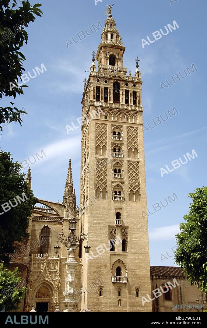Spain. Andalusia. Seville. View of the Giralda tower, (1184-1198). 12th century. Minaret of the old mosque of the city and current bell tower of the cathedral. The tower's first two-thirds is a former minaret from the Berber Almohad period of Seville, the upper third Spanish Renaissance architecture.