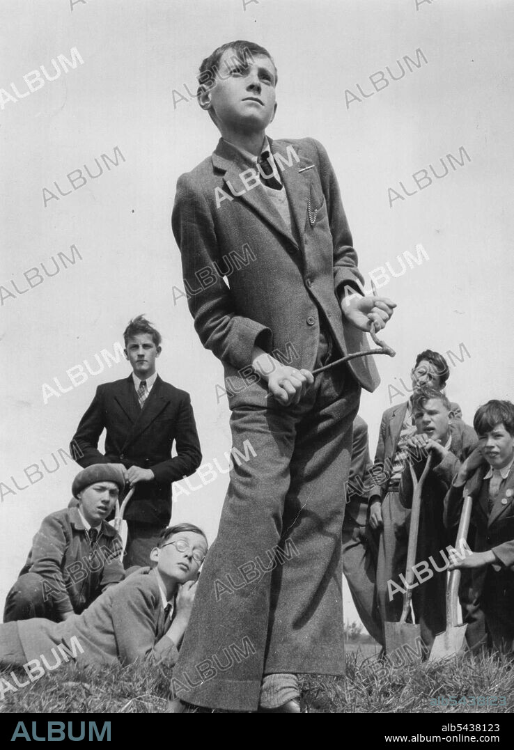 John Facey, 14, (pictured) is tops with his mates in a Devon secondary school. He used his water divining skill to find the spring which was flooding their playing field. His father and grandfather were diviners, too. May 16, 1955. (Photo by Daily Mirror). ;John Facey, 14, (pictured) is tops with his mates in a Devon secondary school. He used his water divining skill to find the spring which was flooding their playing field. His father and grandfather were diviners, too.