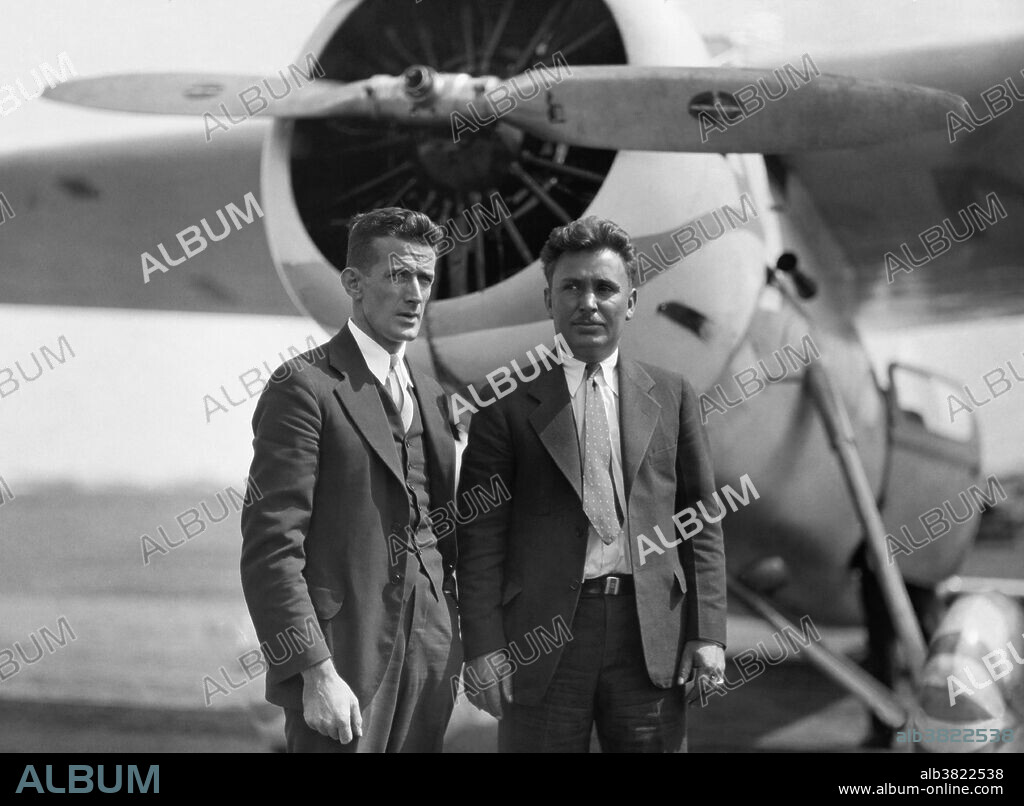 Editorial use only . 1933 photograph of pilot Wiley Post and navigator Harold Gatty with their plane, 'Winnie Mae.' In 1931, the two set the record for aerial circumnavigation of the globe.