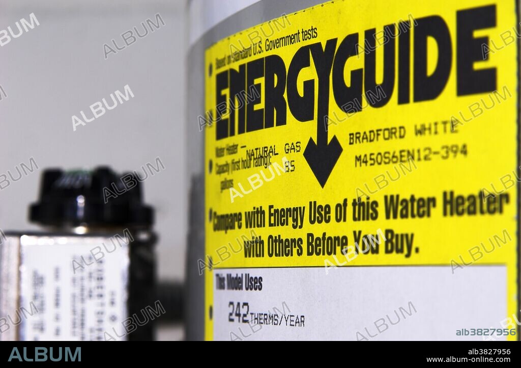US Energy Guide label on a household water heater. The US Federal Trade Commission's Appliance Labeling Rule requires manufacturers to put yellow-and-black Energy Guide labels on most major home appliances such as refrigerators, dishwashers, clothes washers, water heaters and air conditioners. These labels contain information about the energy efficiency of a particular appliance. The efficiency ratings are based on standard test procedures developed by the US Department of Energy. Shown here is the Energy Guide label on a natural gas water heater manufactured by Bradford White. Photo Sept 2007.