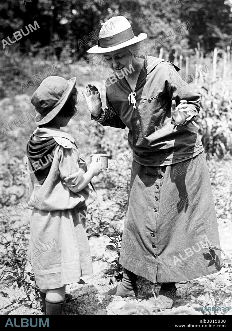 Girl Scouts picnic at home of Mr.s Herbert Hoover. Lou Henry Hoover (March 29, 1874 - January 7, 1944) was the wife of Herbert Hoover and served as First Lady of the United States from 1929 to 1933. She served as the national president of the Girl Scouts of the USA from 1922 to 1925 while Hoover served in the cabinet of Presidents Warren G. Harding and Calvin Coolidge. She served as president again after leaving the White House, from 1935 to 1937. Camp Lou Henry Hoover in New Jersey, is named for her and run by the Heart of New Jersey Council of the Girl Scouts. She funded the construction of the first Girl Scout house in Palo Alto, California. The oldest Girl Scout house in continuous use, it was called Lou Henry Hoover Girl Scout House. Photographed by Harris & Ewing, 1918.