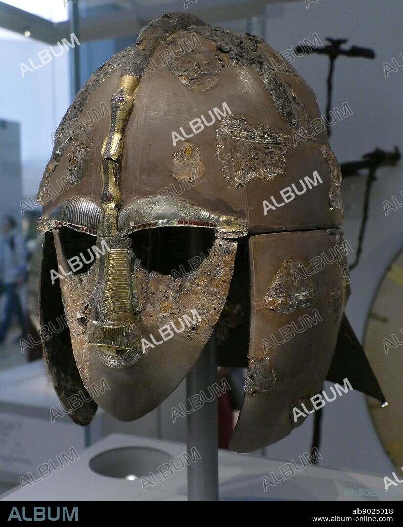 reconstruction of the Sutton Hoo helmet, a decorated Anglo-Saxon helmet discovered during the 1939 excavation of the Sutton Hoo ship-burial. Buried around 625 AD. it is believed to have been the helmet of King Raedwald; for whom its elaborate decoration may have given it a secondary function almost akin to a crown.