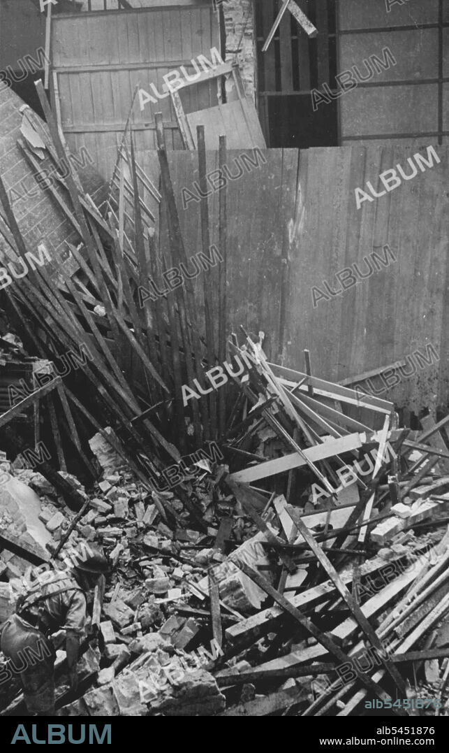 Jap attack on Singapore.A.RP. Workers searching for injured. February 20, 1942.