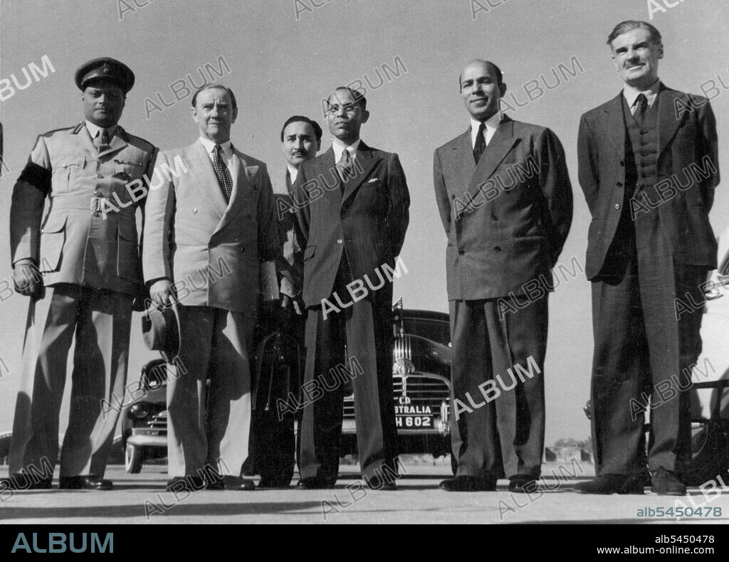 Australian Foreign Minister Arrives In New Delhi -- The Hon'ble Mr. P.C. Spender, K.C., M.P., the Australian Foreign Minister, arrived at Willingdon airport, New Delhi, on January 16, following the conclusion of the Colombo Conference. This group photograph was taken on his arrival at the airport. Left to right: Col. Chatterji, Military Secretary to H.E. the Governor General; the Hon'ble Mr. Spender; Mr. S. Dutt, Additional Secretary, External Affairs Ministry; Mr. B.K. Kapur, Chief of Protocol, Government of India and Sir Archibald Nye, U.K. High Commissioner in India. January 16, 1950. (Photo by Press Information Bureau Government Of India).