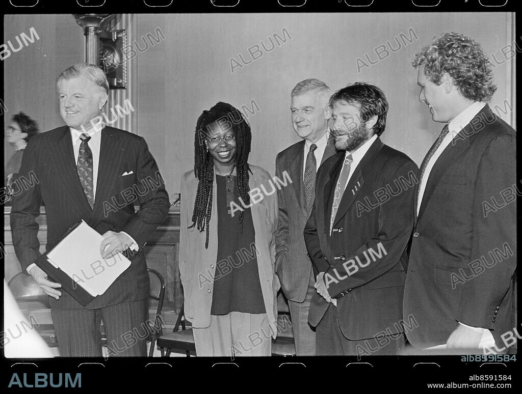 Senator Ted Kennedy (left), Senator Mark Hatfield (center) and Representative Joseph Kennedy IV (right) with Comic Relief members Whoopi Goldberg and Robin Williams, Washington, DC, 5/9/1990.