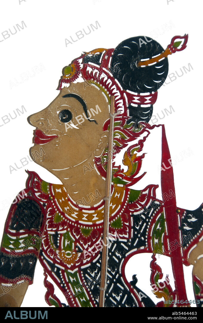 Nang talung' is the shadow puppet theatre popular in southern Thailand. It is an art form said to have originated as early as 400 BC in Southeast Asia. Performances usually last well into the night and remain an essential if diminishing part of village life in Thailand's Deep South. Nang means animal hide, from which the figures are cut. Talung refers to Phatthalung, a town in southern Thailand where the art form is said to have originated.  It is the task of a single skilled person, the 'nai nag' or puppet master, to create the whole show. Sitting behind an illuminated screen, he maneuvers up to six puppets per scene. The changing tone of the puppeteers voice differentiates between the characters, while a band of musicians adds tension to the story. While the more formal 'nang yai' is based on the Hindu epic the Ramayana known as the Ramakien in Thai 'nang talung' takes its inspiration from everyday life.