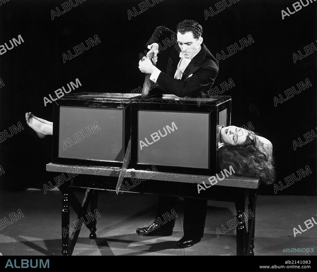 Magician sawing woman in half.