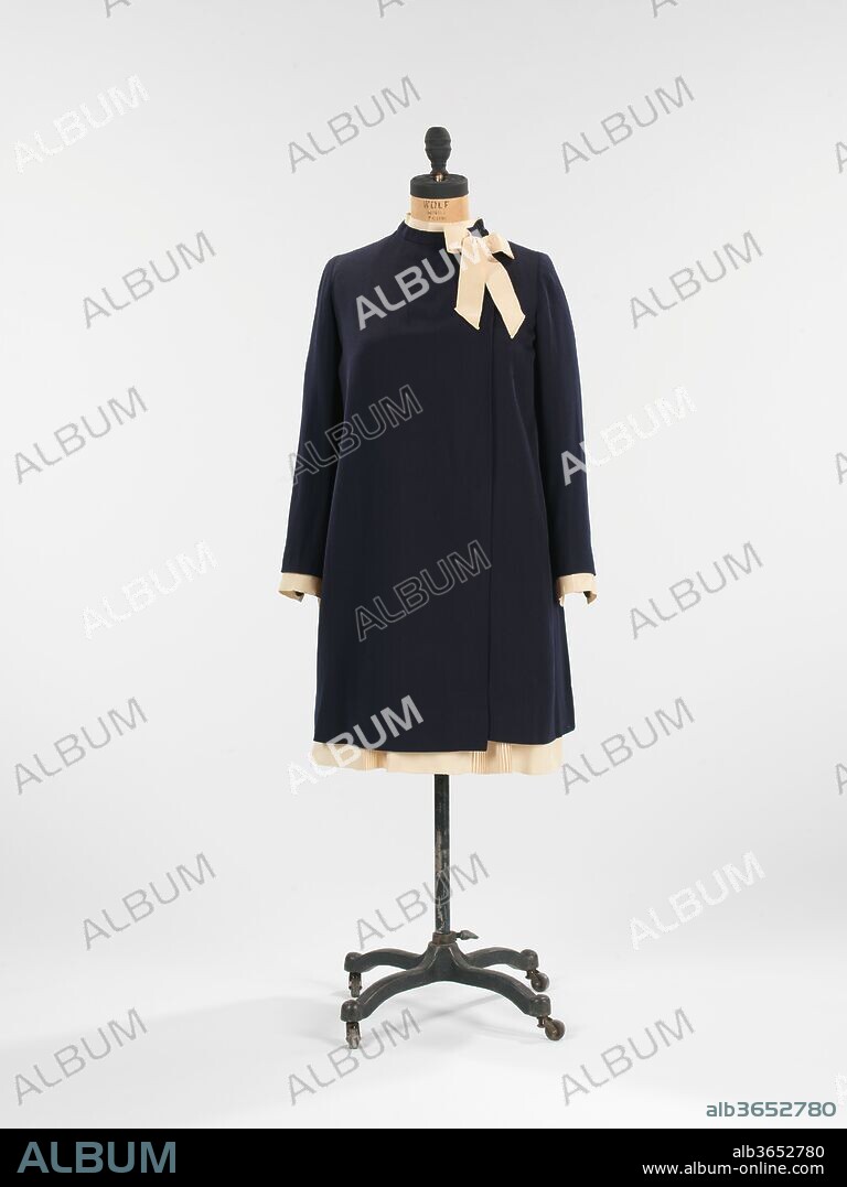 Ensemble. Culture: French. Design House: House of Lanvin (French, founded 1889). Designer: Jeanne Lanvin (French, 1867-1946). Date: ca. 1926.
Jeanne Lanvin was apprenticed to a milliner and a dressmaker before opening her own millinery shop in 1889.  She expanded into dressmaking when her clients began asking for the ensembles in which she adorned her daughter, Marguerite di Pietro (1897-1958).  Her style embodied the femininity of youth in a most modern way with meticulous and relatively sparse surface embellishments and robe de style silhouettes, which could be worn by women of all ages.  Lanvin's aptitude can be seen through her house's 1920s expansion into fur, lingerie, men's wear, household goods and perfume. She even had the forethought to open her own dye factory which produced the inimitable 'Lanvin blue.'  The longevity of the House of Lanvin can be credited to her attentive management and design standards from its inception.
Lanvin Sport was added to the line-up in 1923.  This particular Sport dress shows Lanvin's interests in creating comfortable leisure ensembles for women which would reflect the sportier lifestyle which became more socially acceptable throughout the early 20th century.  The obvious mix of pleated tennis skirts with the length and fit of girl's dresses make it a nice example of her children's wear origin and French sportswear, a field which would later become a hallmark of American designers Claire McCardell and Bonnie Cashin.