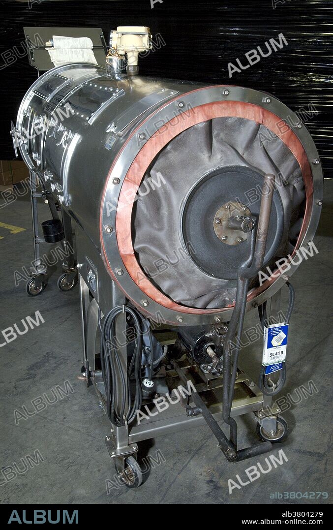 Made of stainless steel, and still in good working order, this Emerson respirator, more commonly referred to as an "iron lung" (shown from the rear) was used by polio patients whose ability to breath was paralyzed due to this crippling viral disease. This iron lung was donated to the CDC's Global Health Odyssey by the family of polio patient, Mr. Barton Hebert of Covington, Louisiana, who'd used the device from the late 1950s until his death in 2003. The chamber is used to create a negative pressure around the thoracic cavity, thereby, causing air to rush into the lungs to equalize intrapulmonary pressure. J. H. Emerson Co. manufactured this type of life saving respirator in the 1930s, but in the 1950's and '60's, the invention of portable ventilators made iron lungs obsolete. By 1970, J. H. Emerson Co. ceased manufacturing this apparatus, but many still depend on such mechanical ventilation systems on a daily basis.