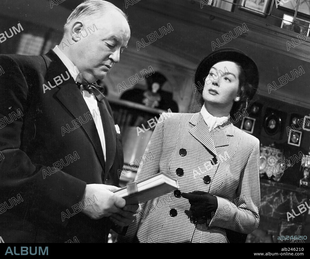 ROSALIND RUSSELL and SYDNEY GREENSTREET in THE VELVET TOUCH, 1948, directed by JOHN GAGE. Copyright RKO.