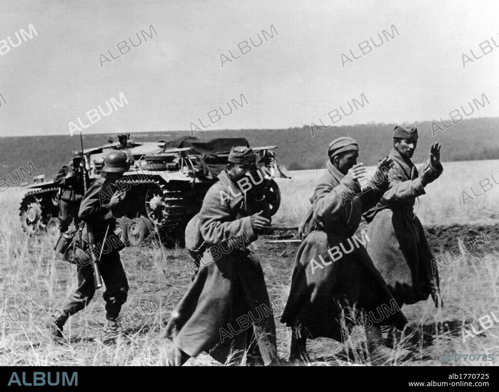 Three Russian soldiers surrendering. Three Soviet soldiers surrendered during battle being escorted by German soldiers. Kerch, May 1942.