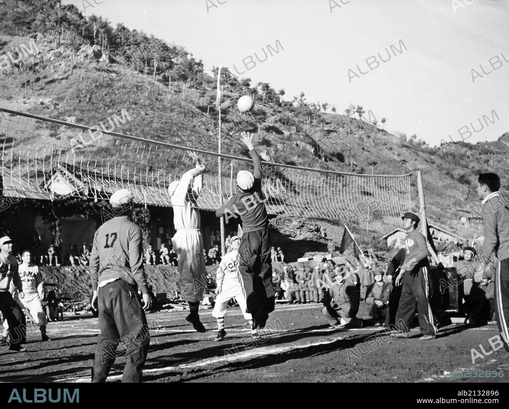 Korean War. A volleyball match between Camps 2 and 3 in the POW's Inter-camp Olympics sponsored by the Chinese People's Volunteers and the Korean People's Army. These games were held from November 15 through the 26th in 1952 somewhere in Korea. (Photo by: Sovfoto/UIG via Getty Images).