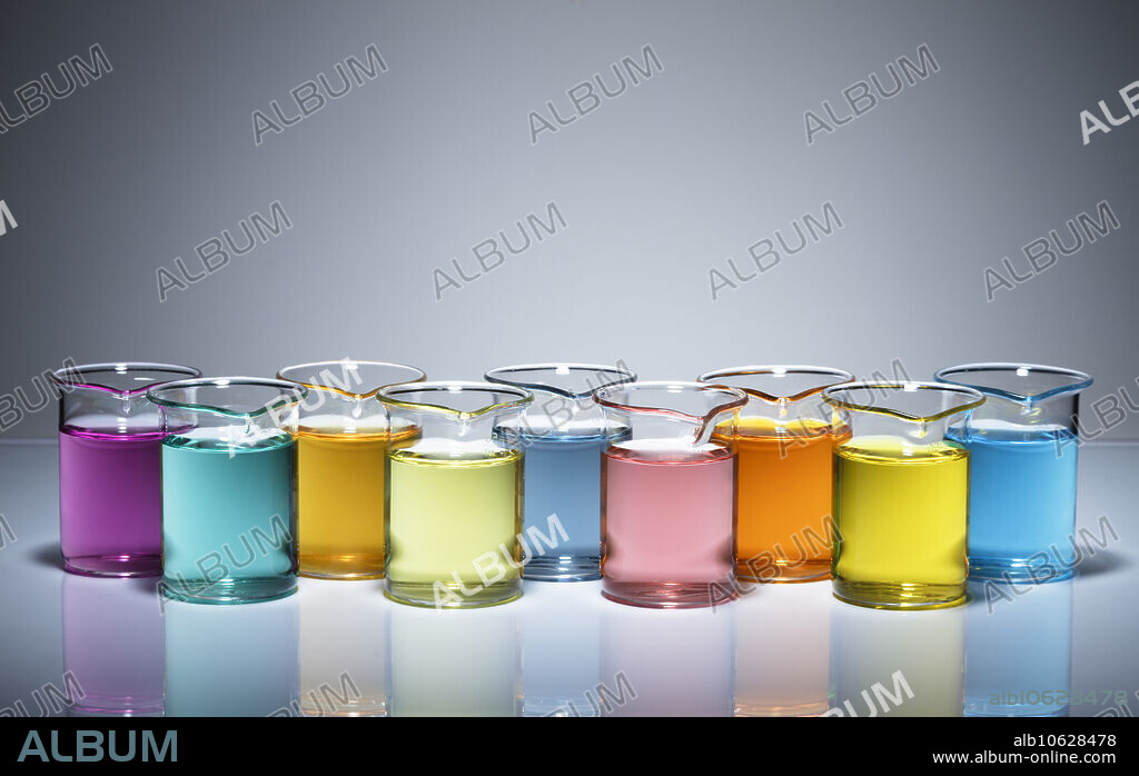 Transition metal solutions. Beakers with solutions of transition metal salts. Compounds containing transition metals are often coloured. Left to right: potassium permanganate (KMnO4, magenta-violet), nickel sulphate (NiSO4, green-blue), iron (III) chloride (FeCl3, brown-yellow), ammonium metavanadate (V) (NH4VO3, yellow), chromium (III) potassium sulphate (KCr (SO4)2, blue), cobalt chloride (CoCl2, rose-red), potassium dichromate (VI) (K2Cr2O7, orange-red), potassium chromate (VI) (K2CrO4, yellow), copper sulphate (CuSO4, blue).
