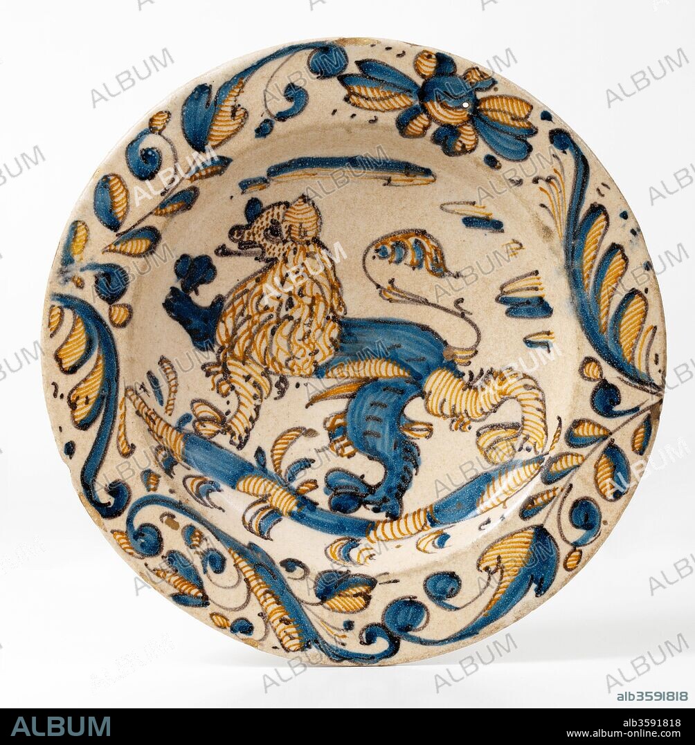 Plato, Finales del siglo XVI - siglo XVII, Cerámica (Serie tricolor; loza decorada en azul, naranja y negro, con león pasante rodeado de motivos vegetales), de Talavera de la Reina o Puente del Arzobispo (Toledo), Diámetro: 33,4 cm.