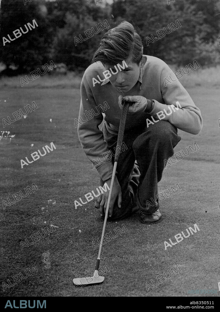 At practice at Redhill is 15-year-old. George Johns, the youngest-ever golfer to reach the last l6 in the "Evening News" Week-end Tournament. George, a Redhill and Reigate schoolboy, plays his next tournament match at Romford on September 8. At practice at Redhill, England, is 15-year-old George Johns, youngest golfer ever to reach the last 16 in the Evening News Weekend Tournament. He plays his next match on Wednesday. August 24, 1954. (Photo by Daily Mail Contract Picture).