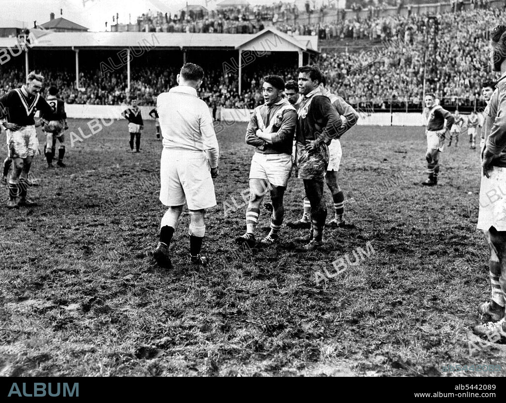Aubert folds his arms in a defiant attitude as he argues with the referee in an Auckland Test between France and N.Z. There were wild scenes in the match in which Mar-tin Martin, shown with Aubert, was sent off.  French Rugby League captain Puig-Aubert ***** his arms in a defiant attitude as he speaks to ***** referee during the Test against NZ at Auckland last Saturday. Wild scenes marked the match, French forward M. Martin being gent off. Puig Aubert frequently spoke to the referee, but was waved aside. August 08, 1951.